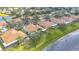 Lakeside community aerial view with lush landscaping and mature trees at 1219 Huntington Greens Dr, Sun City Center, FL 33573