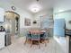 Bright dining area features a round wood table with cushioned chairs and neutral tones at 1219 Huntington Greens Dr, Sun City Center, FL 33573