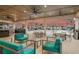 Outdoor poolside patio area with stylish furniture and beautiful skies at 1219 Huntington Greens Dr, Sun City Center, FL 33573