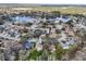 Nice aerial view of a beautiful neighborhood with many trees and a large lake nearby at 12503 Willow Tree Ave, Hudson, FL 34669