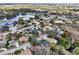 Scenic aerial shot of a suburban neighborhood showcasing houses near picturesque lakes and lush greenery at 12503 Willow Tree Ave, Hudson, FL 34669