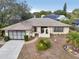 Charming single-story home with landscaped front yard, attached garage, and inviting entryway at 12503 Willow Tree Ave, Hudson, FL 34669