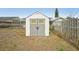 Backyard shed with double doors and a stylish design, perfect for storage or a workshop at 12503 Willow Tree Ave, Hudson, FL 34669