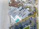 Aerial view of this multi-story waterfront building, parking lot, nearby beach and tropical landscaping at 1590 Gulf Blvd # 501, Clearwater Beach, FL 33767