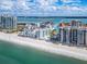 Coastal community with condo buildings, sandy beach, and tranquil waterfront views at 1590 Gulf Blvd # 501, Clearwater Beach, FL 33767