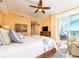 Bright bedroom with a king bed, and access to balcony with ocean views at 1590 Gulf Blvd # 501, Clearwater Beach, FL 33767