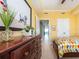 Bedroom with tiled floor, dresser, and an open door leading to a view of the sea at 1590 Gulf Blvd # 501, Clearwater Beach, FL 33767