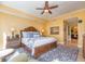 Bright bedroom with a king bed, ensuite bathroom, and ocean-themed decor at 1590 Gulf Blvd # 501, Clearwater Beach, FL 33767