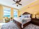 Bright bedroom with a king bed, ceiling fan, and amazing ocean view at 1590 Gulf Blvd # 501, Clearwater Beach, FL 33767