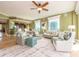 Bright, open living room with comfortable seating, tropical decor, and expansive windows showcasing city views at 1590 Gulf Blvd # 501, Clearwater Beach, FL 33767