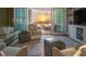 Relax in this comfortable living room with sunset views and stylish decor at 1590 Gulf Blvd # 501, Clearwater Beach, FL 33767