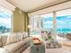 Bright living room boasts stylish furnishings and a panoramic view of the ocean at 1590 Gulf Blvd # 501, Clearwater Beach, FL 33767