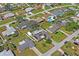 An aerial view shows the property nestled in a neighborhood with well-maintained lawns and mature trees at 1782 Coconut Dr, Venice, FL 34293
