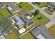 Aerial view of house with solar panels shows the property's roof, landscaping, curb appeal and neighborhood surroundings at 1782 Coconut Dr, Venice, FL 34293