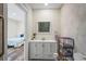 Updated bathroom vanity and shower with easy access door to the bedroom at 1782 Coconut Dr, Venice, FL 34293