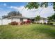 Charming single Gathering home features stone accents, an expansive lawn, mature shade trees and well maintained landscaping at 1782 Coconut Dr, Venice, FL 34293