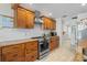 Beautiful kitchen featuring custom wood cabinets, granite countertops, stainless steel appliances, and modern fixtures at 1782 Coconut Dr, Venice, FL 34293