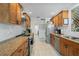 Well-appointed kitchen with stainless steel appliances, custom cabinets, and ample counter space at 1782 Coconut Dr, Venice, FL 34293