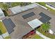 The roof features solar panels to reduce energy costs at 1782 Coconut Dr, Venice, FL 34293