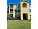 Condominium building showcasing balconies, windows, and a well-maintained lawn at 18121 Bridle Club Dr # 18121, Tampa, FL 33647