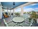 Charming balcony with wrought iron railing offers panoramic waterfront views at 199 21St Ave, St Pete Beach, FL 33706