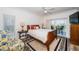 Cozy bedroom with a wood bed frame, neutral decor, and access to a private balcony at 199 21St Ave, St Pete Beach, FL 33706
