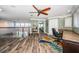Bonus room with wood look floors, large windows, and built-in desk at 199 21St Ave, St Pete Beach, FL 33706