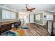 Bonus room with wood look floors, large windows, and built-in desk at 199 21St Ave, St Pete Beach, FL 33706