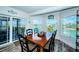 Elegant dining room with water views, a wood table, and seating for six at 199 21St Ave, St Pete Beach, FL 33706