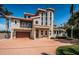 Stunning two-story home with circular drive and lush landscaping, exuding curb appeal and timeless elegance at 199 21St Ave, St Pete Beach, FL 33706