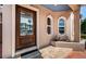 Charming front entrance with a decorative glass door and unique oval windows, adding character and curb appeal at 199 21St Ave, St Pete Beach, FL 33706