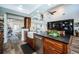 Bright kitchen offers an island with granite countertops and farm-style sink at 199 21St Ave, St Pete Beach, FL 33706