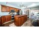 Gourmet kitchen with stainless appliances and custom butcher block island at 199 21St Ave, St Pete Beach, FL 33706