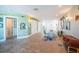 Spacious living area with tile flooring, stylish decor, and multiple doorways leading to other rooms at 199 21St Ave, St Pete Beach, FL 33706