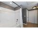 Bright bathroom featuring a shower-over-tub combo and white tiled walls at 2010 E Palm Ave # 14206, Tampa, FL 33605