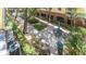 View of the grounds with picnic seating, manicured lawn, and mature trees at 2010 E Palm Ave # 14206, Tampa, FL 33605
