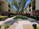 Exterior view of the community showcasing the buildings, courtyard and well-manicured landscaping at 2010 E Palm Ave # 14206, Tampa, FL 33605