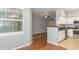 View from dining area into living room and kitchen with stainless steel appliances at 2010 E Palm Ave # 14206, Tampa, FL 33605