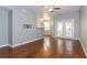 Open-concept living room with hardwood floors, neutral paint, and access to a balcony at 2010 E Palm Ave # 14206, Tampa, FL 33605