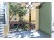 View from the balcony features exterior elevation, wrought iron railing, and ceiling fan at 2010 E Palm Ave # 14206, Tampa, FL 33605