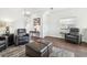 Neutral living room with vaulted ceilings and leather recliner chairs at 2044 Greenwood Valley Dr, Plant City, FL 33563