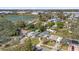Aerial view of neighborhood showcasing tree-lined streets and a pond in the distance at 2851 16Th N Ave, St Petersburg, FL 33713