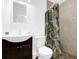 A full bathroom featuring a decorative shower curtain and a single sink vanity at 2851 16Th N Ave, St Petersburg, FL 33713