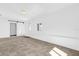 Spacious living room with tiled floor, window, and a white sliding door at 2851 16Th N Ave, St Petersburg, FL 33713