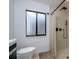 Contemporary bathroom includes walk-in shower, modern fixtures, and tiled walls for a clean, sophisticated look at 29318 Whipporwill Ln, Wesley Chapel, FL 33543