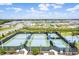 Aerial view of tennis courts, basketball court, and surrounding neighborhood at 3098 Mountain Spruce Ter, Wesley Chapel, FL 33543