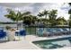 Charming backyard patio and pool area with comfortable lounge chairs and vibrant blue accents at 4900 59Th S Ave, St Petersburg, FL 33715