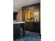 Chic bar area featuring custom cabinetry, beverage fridge, and stylish accents at 4900 59Th S Ave, St Petersburg, FL 33715
