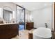 Elegant bathroom featuring dual vanities, modern fixtures, and a freestanding soaking tub at 4900 59Th S Ave, St Petersburg, FL 33715