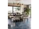 Inviting dining room with brick accent wall, modern lighting, and tranquil waterfront views at 4900 59Th S Ave, St Petersburg, FL 33715